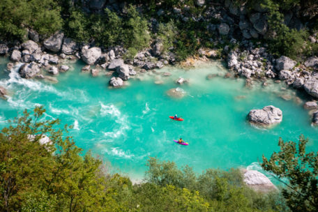 Two people paddling on turquoise water at Private Course .